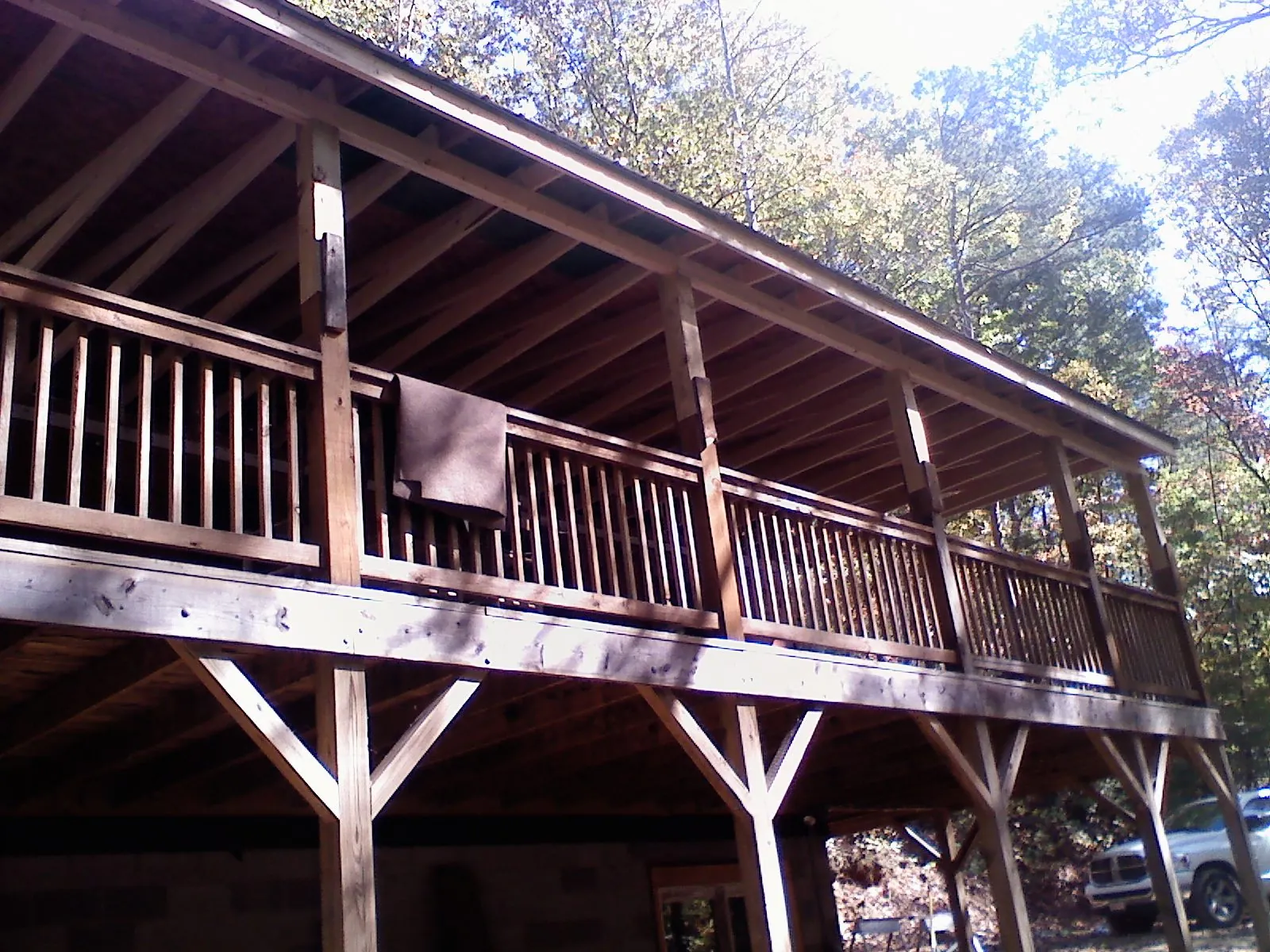 Timber framing under a new elevated porch and deck — Roof Leak Repair in Quebeck by Roofing Brothers